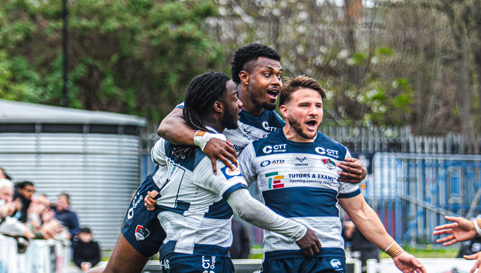 Players celebrating a try
